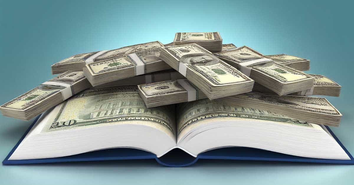 Stacks of hundred-dollar bills rest on an open book, symbolizing the wealth generated by the multi-billion dollar textbook industry, set against a light blue background.