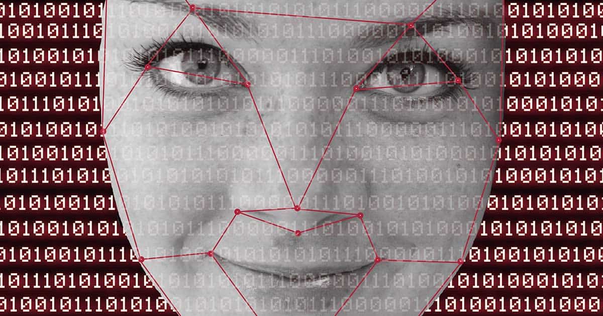 A grayscale image of a woman's face overlaid with facial recognition network lines and binary code in the backdrop, reflecting the digital age and the rise of synthetic media called deepfakes.