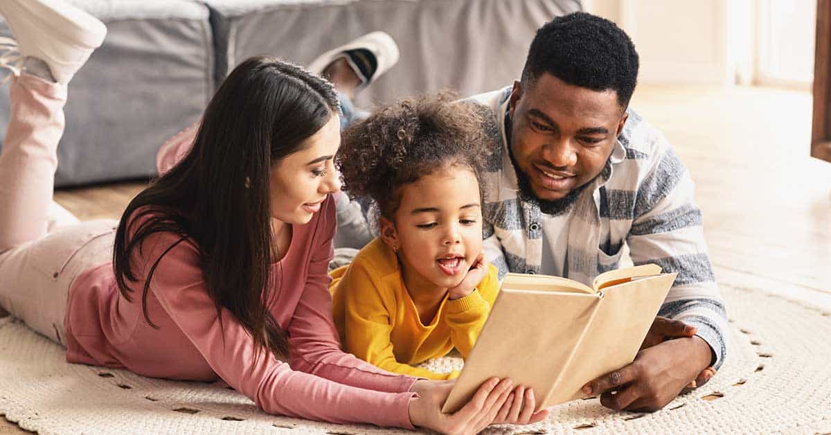 Parents reading to their child fostering early literacy development