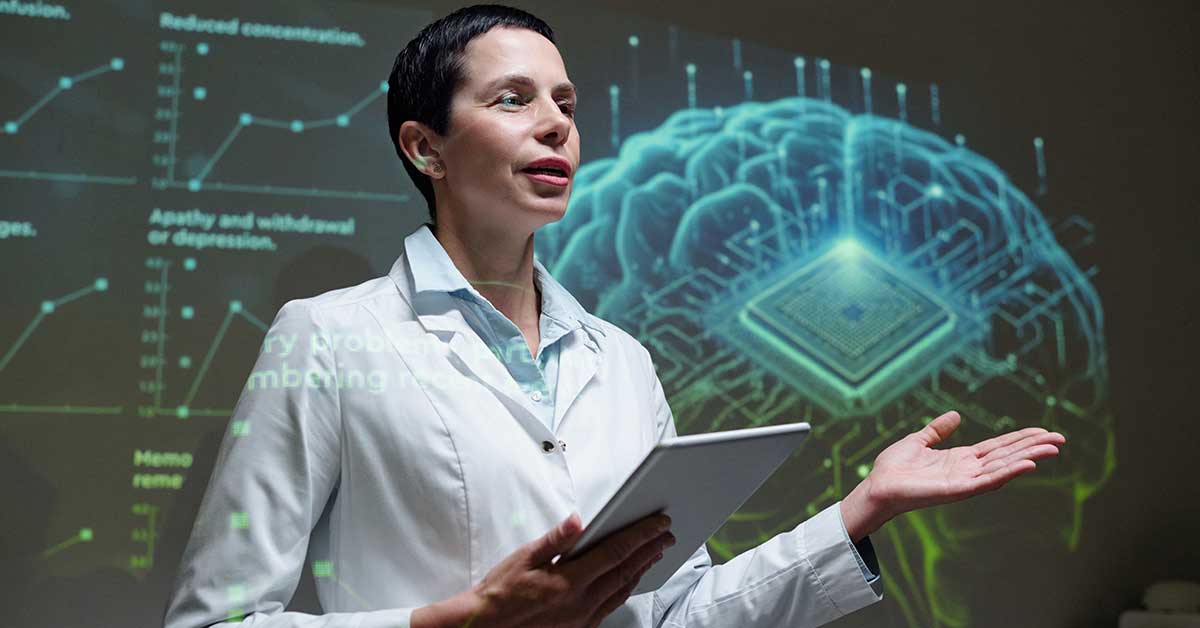 A woman in a lab coat holds a tablet and speaks in front of a digital screen showing a brain graphic and scientific charts, addressing the silent workforce crisis impacting the healthcare industry.